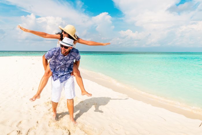 Couple,In,Love,Tropical,Beach,With,Turquoise,Ocean,And,Sunshine